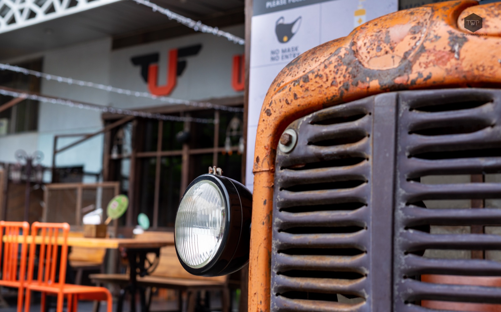 Vintage tractor headlight detail — industrial architecture